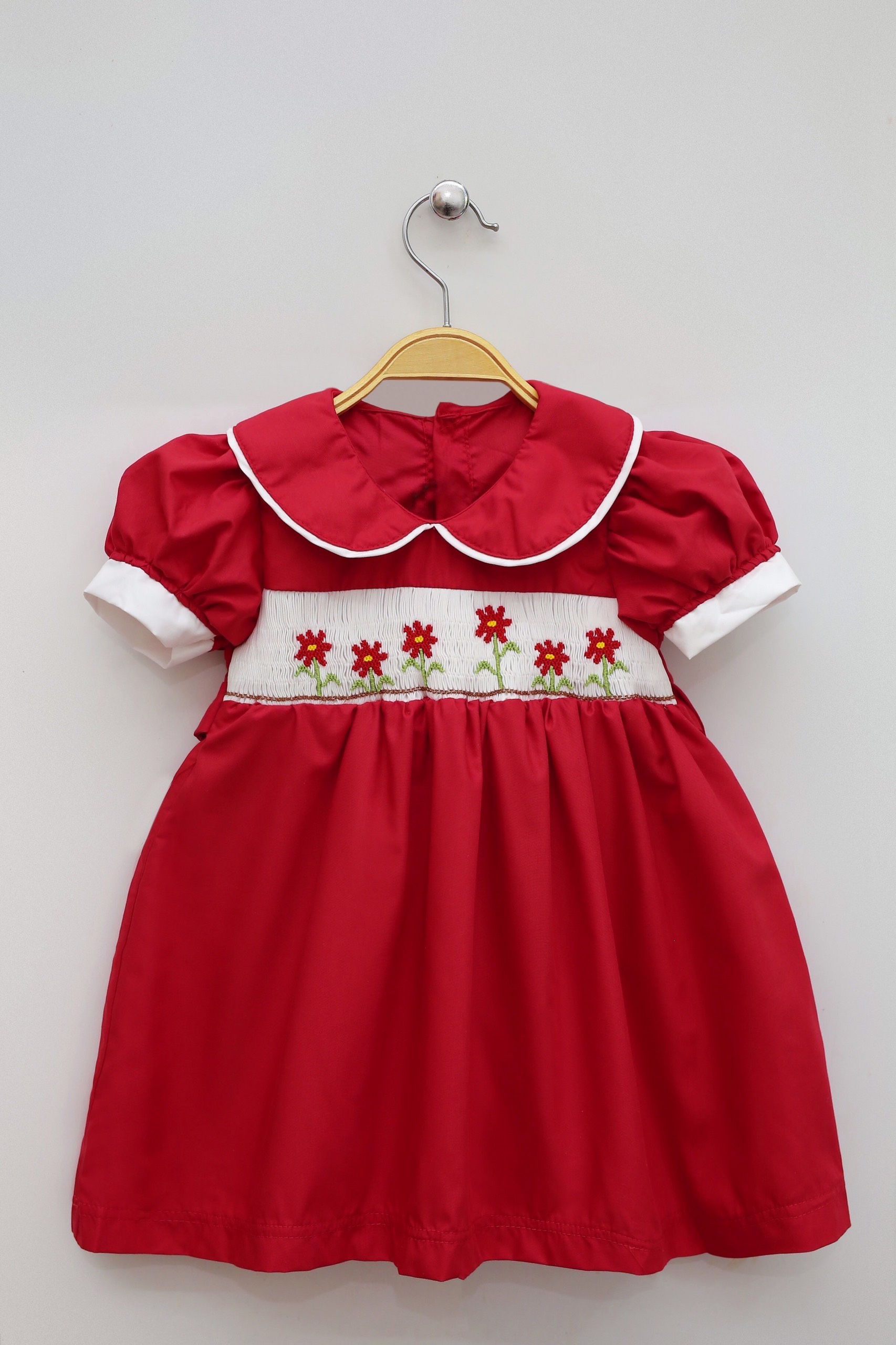 Baby Girl's Red Smocking Dress With Flower Motifs On Tet Holiday