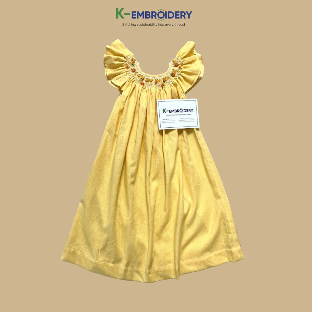 charming smocked beach dress with a yellow motif