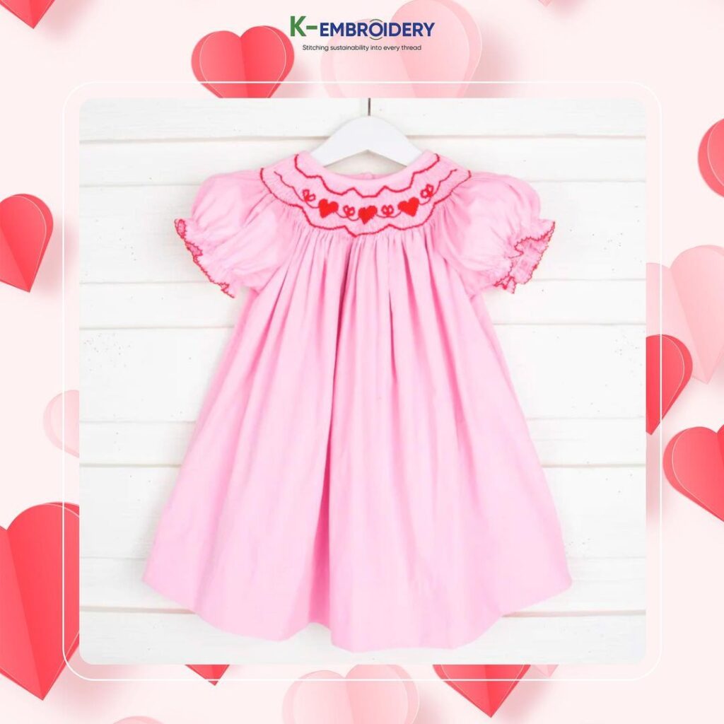 Pink smocked dress with heart motifs - SG 165