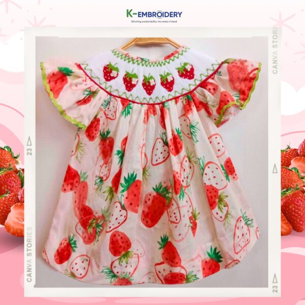 pink smocked dress with strawberry motifs