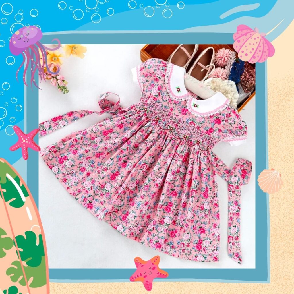Smocked dress with red flower motifs