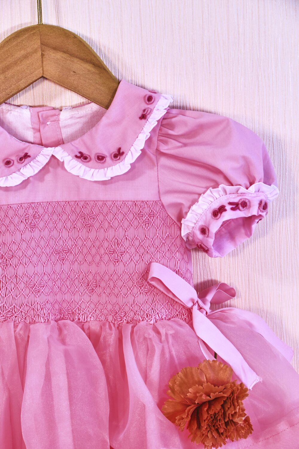 How do I get rid of the urine smell from my baby's clothes? 2 Pink geometric smocked princess dress