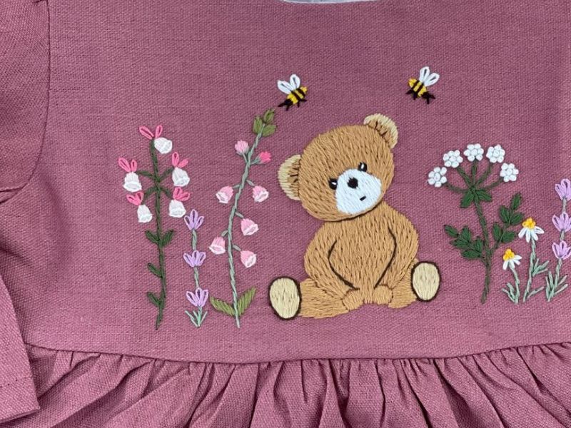 Hand-embroidereded motif on children's dress - K-Embroidery Vietnam artisan work