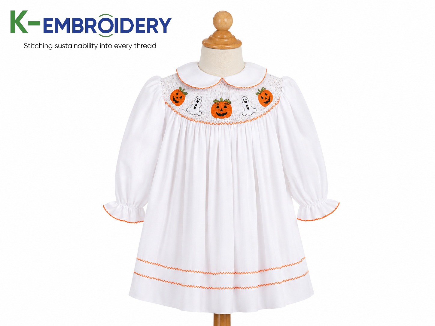 Smocked Halloween Dress: Styles, Sizes & Where to Buy in 2026 3 Bishop smocked Halloween dress — white cotton, Peter Pan collar, pumpkin and ghost embroidery