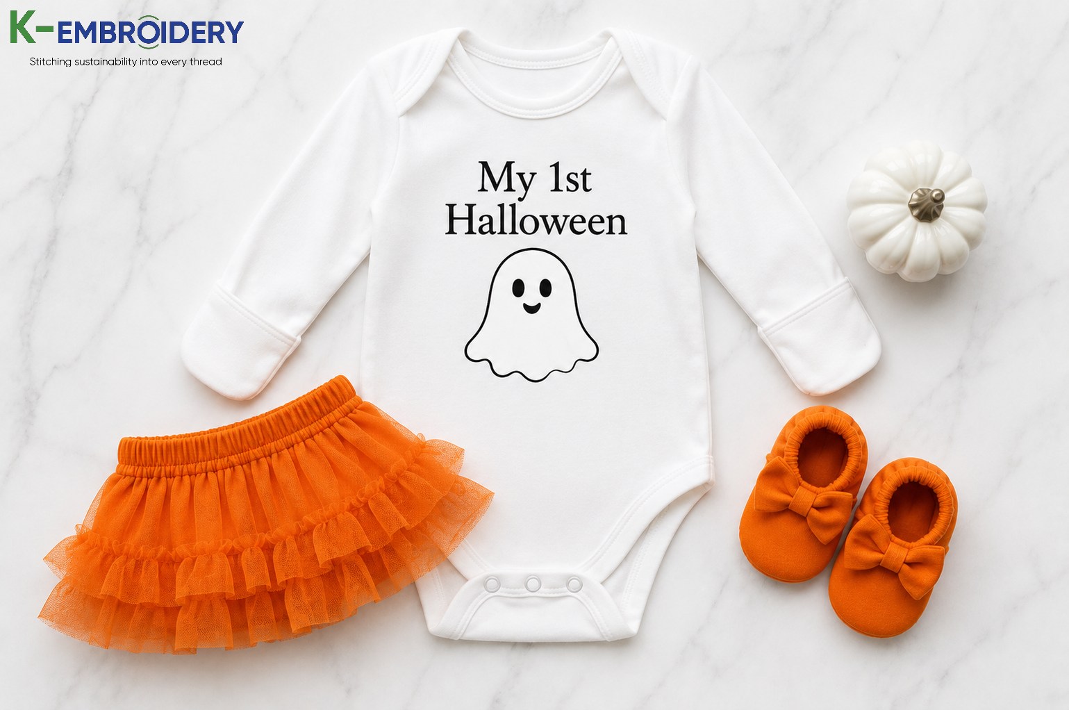 Infant Halloween Outfits: Best Styles, Fabrics & Where to Buy in 2026 4 My first Halloween milestone onesie for newborn — white cotton with ghost graphic print, snap-bottom closure, and mitten cuffs